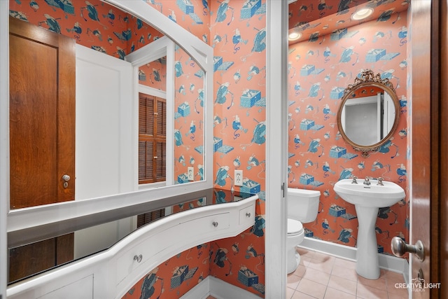 bathroom featuring toilet and tile patterned floors