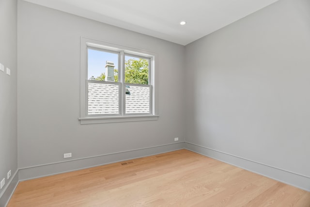 empty room with light hardwood / wood-style floors