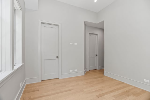 unfurnished bedroom featuring light wood-type flooring