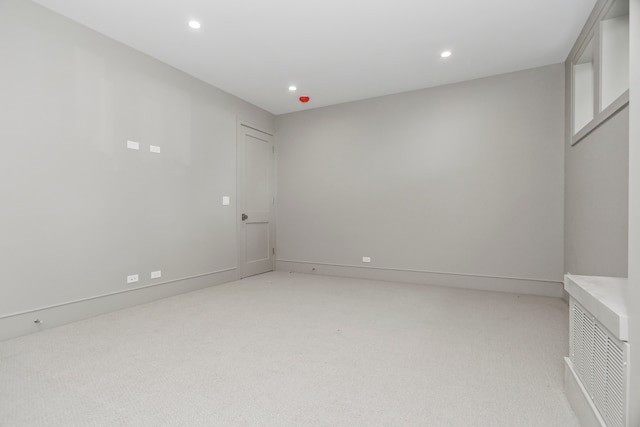 spare room with light colored carpet