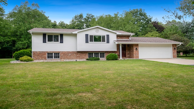 tri-level home featuring a front yard and a garage