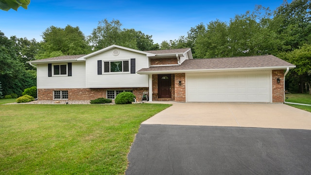 split level home featuring a front lawn and a garage