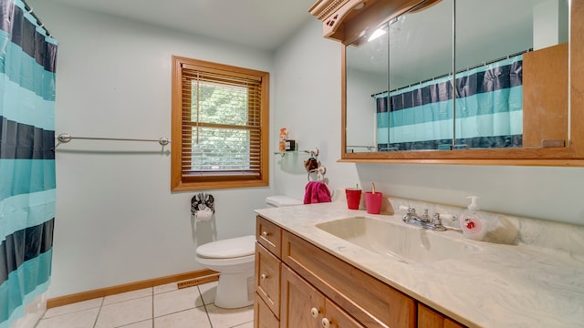 bathroom with vanity, toilet, walk in shower, and tile patterned floors