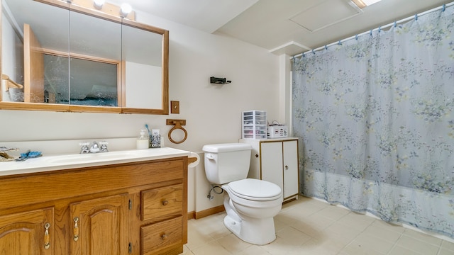 bathroom featuring vanity, toilet, and tile patterned floors