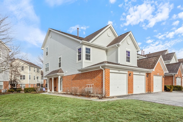 exterior space featuring a garage and a front lawn