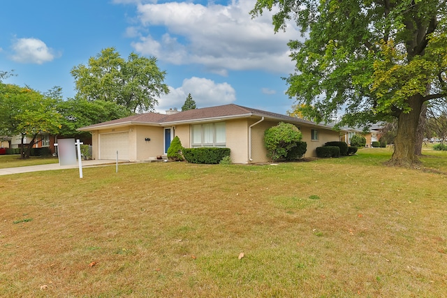 single story home featuring a front lawn and a garage