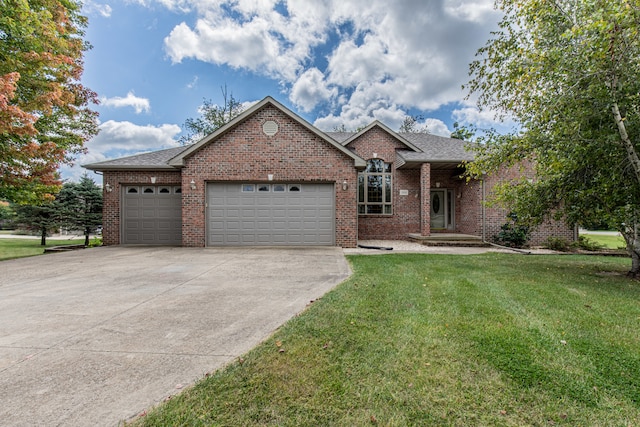 view of front of property with a garage and a front yard