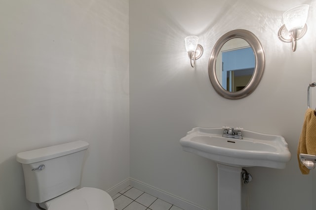 bathroom featuring toilet and tile patterned floors