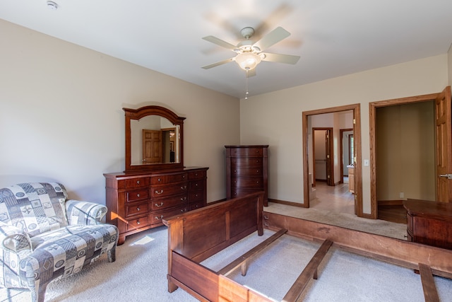 bedroom featuring ceiling fan and light carpet