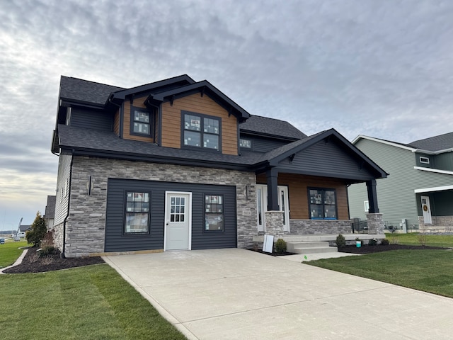 craftsman-style house with a porch and a front lawn