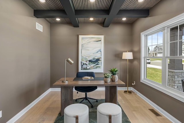 office area with light wood-type flooring, beamed ceiling, visible vents, and coffered ceiling