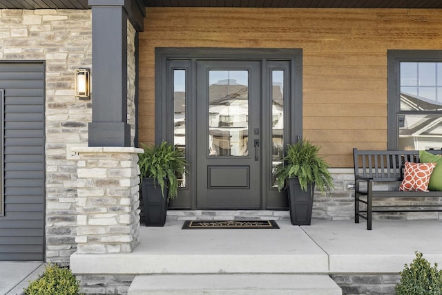 view of exterior entry with stone siding