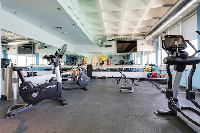 gym with coffered ceiling