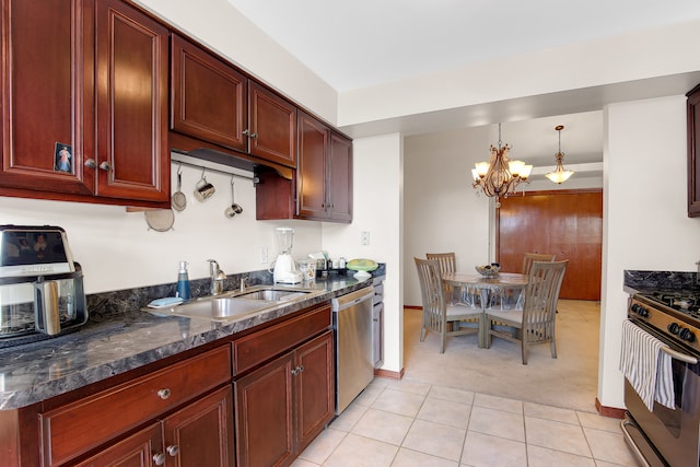 kitchen featuring light carpet, a chandelier, stainless steel appliances, sink, and hanging light fixtures