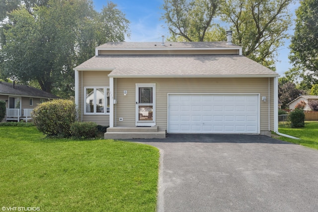 view of front of home featuring a garage and a front lawn