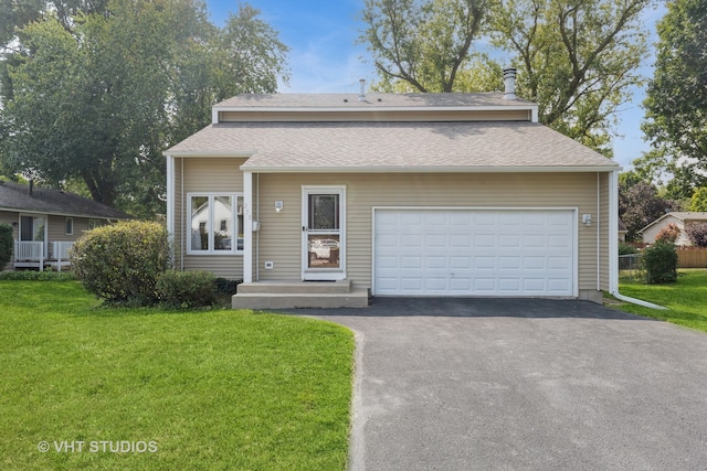 view of front of house featuring a garage and a front yard