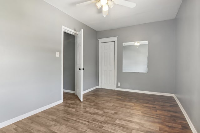 unfurnished room with wood-type flooring and ceiling fan