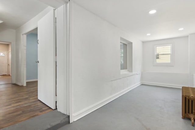 interior space with radiator and dark wood-type flooring