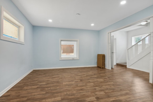 interior space featuring radiator and dark hardwood / wood-style floors