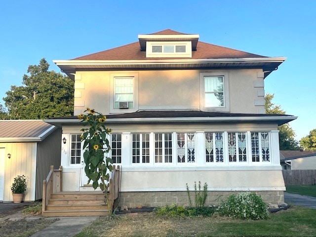 rear view of property featuring cooling unit