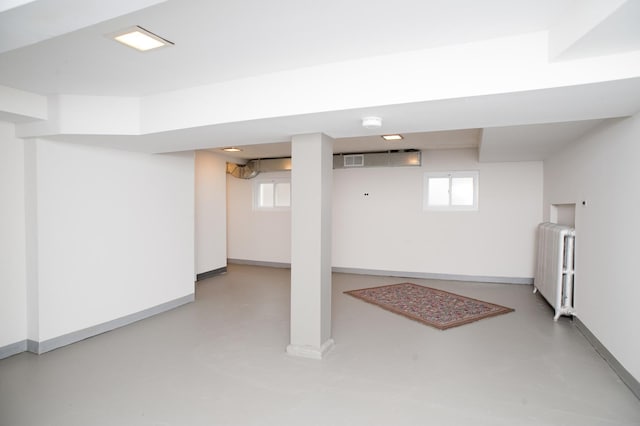 basement featuring radiator heating unit