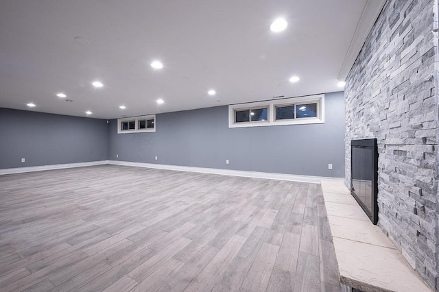 basement with light hardwood / wood-style floors