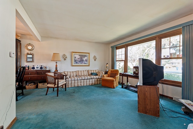 sitting room featuring a healthy amount of sunlight and carpet flooring