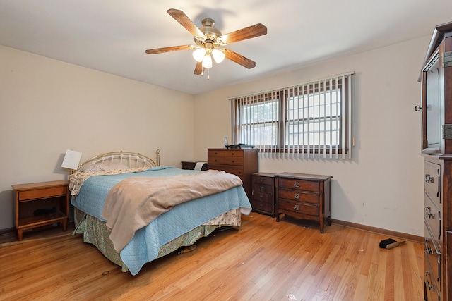 bedroom with light wood-type flooring and ceiling fan