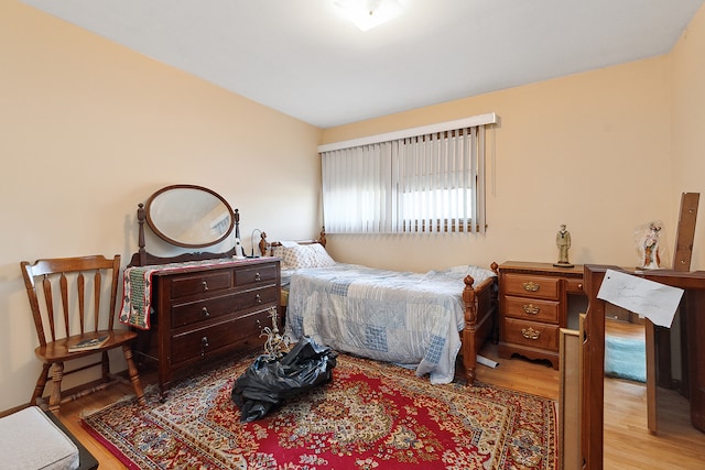 bedroom with light hardwood / wood-style floors