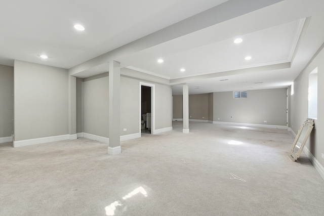 interior space featuring crown molding and a tray ceiling