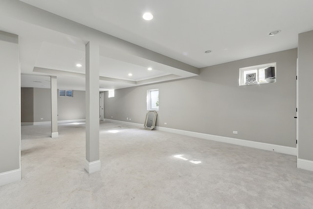 basement featuring light colored carpet