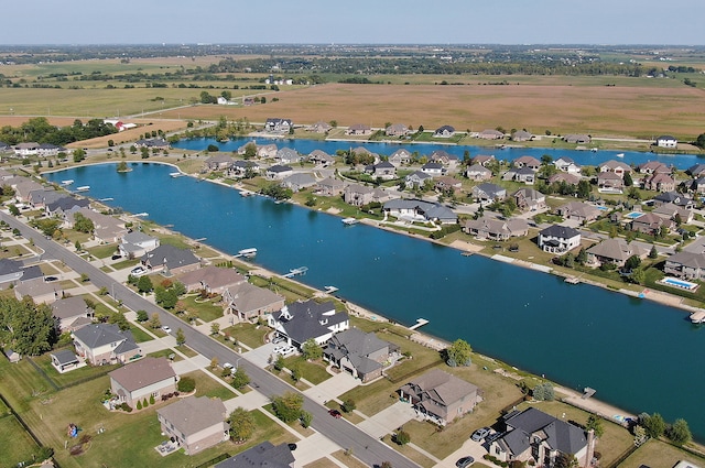 birds eye view of property featuring a water view and a rural view