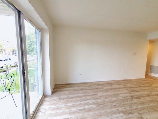 spare room featuring light hardwood / wood-style flooring