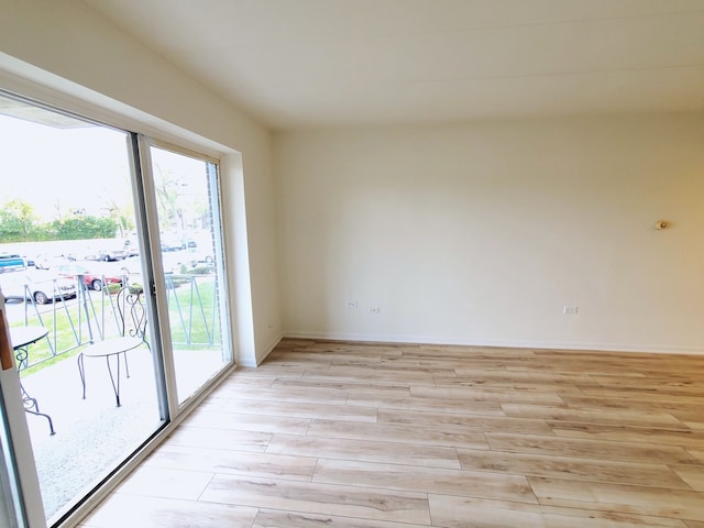 unfurnished room featuring light hardwood / wood-style flooring