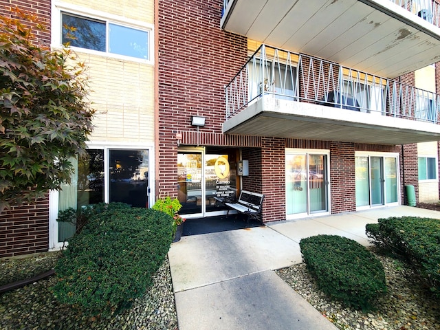 entrance to property with a balcony