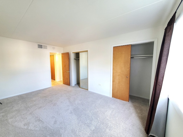 unfurnished bedroom with light carpet