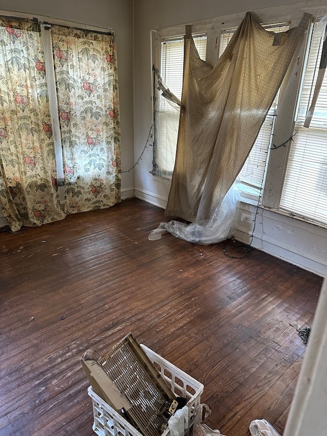 unfurnished room featuring dark hardwood / wood-style floors