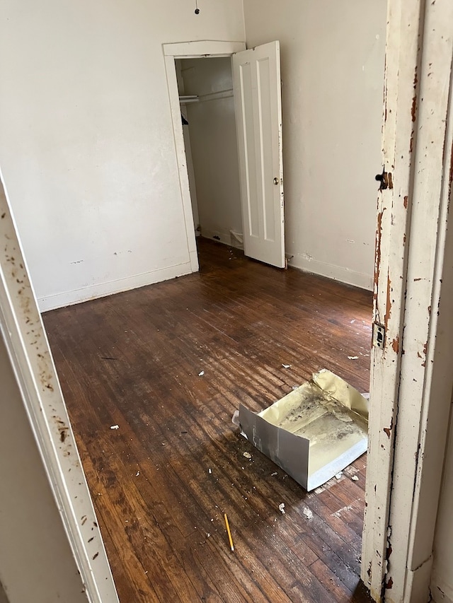 empty room with hardwood / wood-style flooring