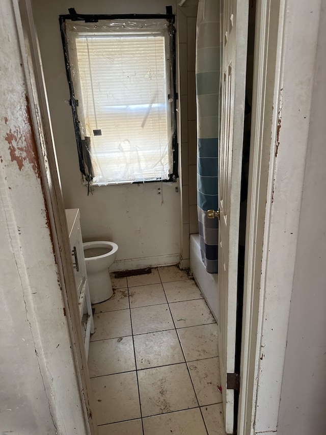 bathroom featuring toilet and tile patterned floors