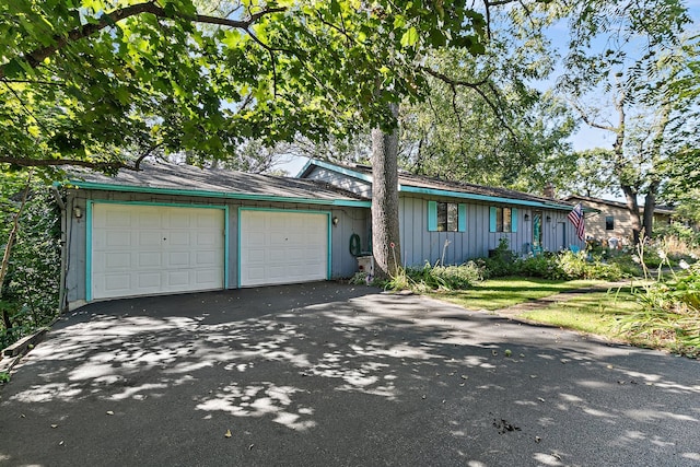 single story home with a garage