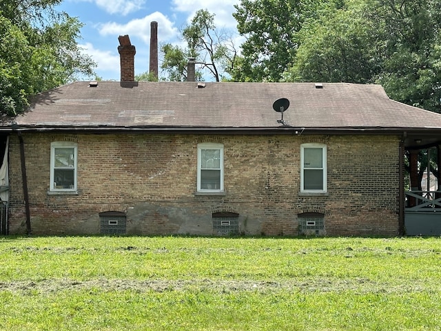 view of home's exterior featuring a yard