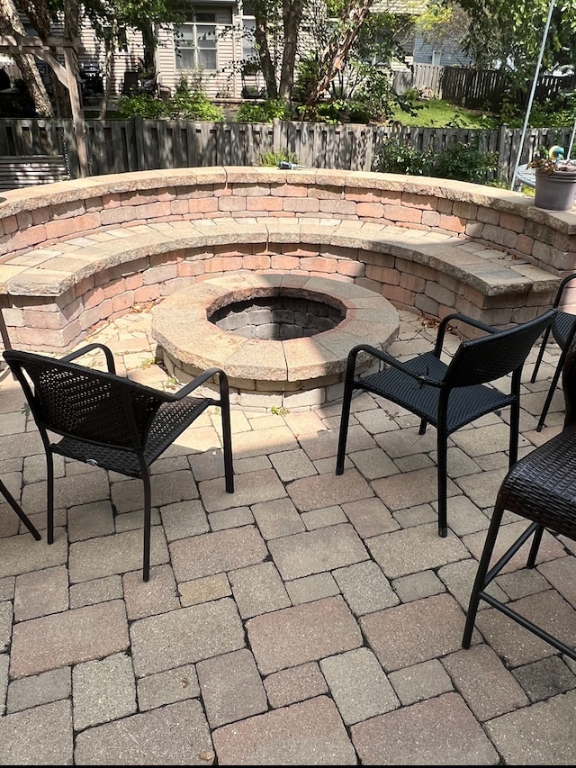 view of patio / terrace with an outdoor fire pit