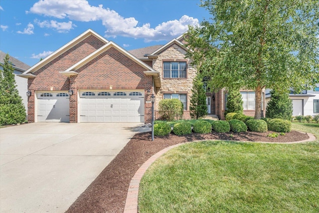view of front of property featuring brick siding, stone siding, a front yard, concrete driveway, and an attached garage