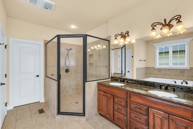 bathroom featuring vanity, plus walk in shower, an inviting chandelier, and tile patterned flooring