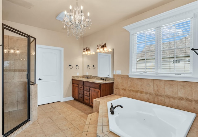 bathroom with plus walk in shower, tile patterned floors, a notable chandelier, and vanity