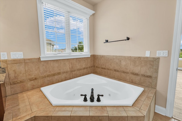 bathroom featuring tiled bath