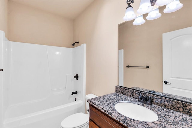 full bath featuring vanity, toilet,  shower combination, and a notable chandelier