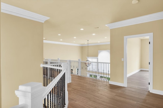 hall featuring ornamental molding and wood-type flooring