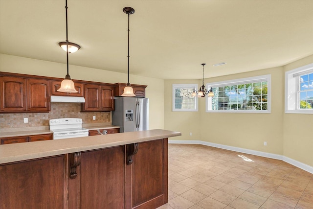 kitchen with white range with electric stovetop, light countertops, baseboards, stainless steel fridge with ice dispenser, and backsplash