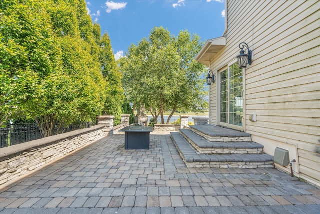 view of patio / terrace featuring a fire pit